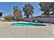 Inviting pool area with mature trees and lounge chairs for relaxing outdoors at 6071 E Ludlow Dr, Scottsdale, AZ 85254