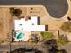 Aerial view of the property highlighting the home's layout, private pool, landscaped yard, and surrounding neighborhood at 6071 E Ludlow Dr, Scottsdale, AZ 85254