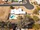 Aerial view of the property showcasing the private pool, modern hardscape, mature landscaping, and the home's expansive layout at 6071 E Ludlow Dr, Scottsdale, AZ 85254