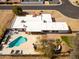 Aerial view of the property showcasing the private pool, modern hardscape, mature landscaping, and the home's expansive layout at 6071 E Ludlow E Dr, Scottsdale, AZ 85254