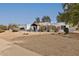 Charming home features a modern architectural style, desert landscaping, and a welcoming front entrance at 6071 E Ludlow Dr, Scottsdale, AZ 85254