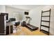 A home office featuring a desk, treadmill, and storage solutions, perfect for working and staying active at 6071 E Ludlow Dr, Scottsdale, AZ 85254
