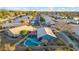 Wide aerial perspective of a neighborhood showcasing homes with pools and outdoor amenities at 644 W Dublin St, Gilbert, AZ 85233