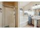 Bathroom featuring a shower stall, a bathtub, and a vanity sink at 644 W Dublin St, Gilbert, AZ 85233