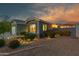 Well-lit front exterior with a neatly landscaped yard and charming curb appeal at 644 W Dublin St, Gilbert, AZ 85233