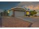 Charming front exterior with a well-maintained driveway and manicured landscaping at 644 W Dublin St, Gilbert, AZ 85233