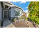 Inviting entryway with a cozy bench, mature tree, and security door at 644 W Dublin St, Gilbert, AZ 85233