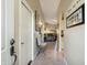 Hallway featuring tile floors and archways, leading to the living spaces at 644 W Dublin St, Gilbert, AZ 85233