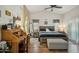 Tranquil main bedroom with a vaulted ceiling, shutters and a cozy sitting area at 644 W Dublin St, Gilbert, AZ 85233