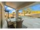 Inviting covered patio with dining table, chairs and view of pool at 644 W Dublin St, Gilbert, AZ 85233