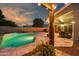 View of the backyard pool area, highlighting the covered seating and outdoor living space at 644 W Dublin St, Gilbert, AZ 85233