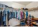 Spacious walk-in closet with ample storage featuring shelving, hanging rods and shoes rack at 644 W Dublin St, Gilbert, AZ 85233