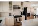 Stylish kitchen featuring stainless steel appliances and subway tile backsplash at 7023 E 4Th St # 104, Scottsdale, AZ 85251