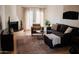 Bright living room with hardwood floors, fireplace and comfortable seating at 7023 E 4Th St # 104, Scottsdale, AZ 85251