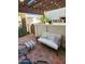 Relaxing patio features comfortable seating, a pergola, and outdoor charm at 7023 E 4Th St # 104, Scottsdale, AZ 85251