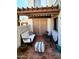 Cozy patio features comfortable seating, a pergola, and charming decor at 7023 E 4Th St # 104, Scottsdale, AZ 85251
