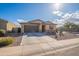 Charming single-story home featuring a two-car garage, low maintenance desert landscaping, and neutral color palette at 7201 E Aerie Way, San Tan Valley, AZ 85143