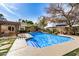 Stunning backyard pool with a pergola-covered dining area, and manicured landscaping at 7744 N 6Th St, Phoenix, AZ 85020