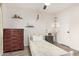 A bright bedroom featuring a single bed, wooden furniture, shelving, and ample natural light at 807 E Harvard Ave, Gilbert, AZ 85234