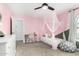 Airy bedroom with plush accents including sheer canopy over the bed, accent pillows, and chair at 807 E Harvard Ave, Gilbert, AZ 85234