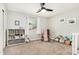 Bright Bedroom featuring neutral walls, hardwood rocking chair, and organized toy storage at 807 E Harvard Ave, Gilbert, AZ 85234