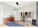 This bedroom features a wooden desk, blue accents, and a shelving unit for storage at 807 E Harvard Ave, Gilbert, AZ 85234