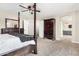 A well-lit primary bedroom features a four-poster bed and matching wood furniture at 807 E Harvard Ave, Gilbert, AZ 85234