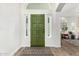 Inviting home entryway featuring a stylish rug, and a view into the cozy living area at 807 E Harvard Ave, Gilbert, AZ 85234