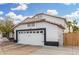 Side exterior view showcasing the two-car garage, complemented by the home's architecture at 807 E Harvard Ave, Gilbert, AZ 85234