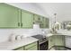 Well-lit kitchen with modern appliances, custom cabinetry, and clean countertops at 807 E Harvard Ave, Gilbert, AZ 85234