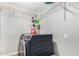Well-lit laundry room with shelving above modern, front-loading washer and dryer at 807 E Harvard Ave, Gilbert, AZ 85234