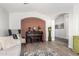 Inviting living area with a grand piano and vintage-inspired decor, creating a cozy ambiance at 807 E Harvard Ave, Gilbert, AZ 85234