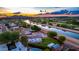 Aerial view of property near the Arizona Canal Trail featuring a pool and scenic desert views at 8432 E Redwing Rd, Scottsdale, AZ 85250