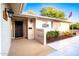 Inviting front entrance with security door and decorative glass block window, perfect for curb appeal at 8432 E Redwing Rd, Scottsdale, AZ 85250