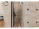 An updated bathroom featuring decorative tiled walls, a shower, and updated fixtures at 8749 E Via De Sereno --, Scottsdale, AZ 85258