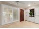 Bright bonus room featuring shuttered windows, light tile floor and lots of storage at 8749 E Via De Sereno --, Scottsdale, AZ 85258