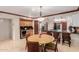 Open dining area with a breakfast bar, table with seating and wooden cabinets with a wine cooler at 8749 E Via De Sereno --, Scottsdale, AZ 85258