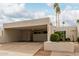 Contemporary home featuring a covered carport, desert landscaping, and clear address numbers at 8749 E Via De Sereno --, Scottsdale, AZ 85258