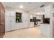 Well-lit kitchen with white cabinets, stainless steel appliances, and marble countertops at 8749 E Via De Sereno --, Scottsdale, AZ 85258