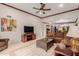 Spacious living room featuring ceiling fan, TV, and comfortable seating at 8749 E Via De Sereno --, Scottsdale, AZ 85258