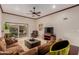Comfortable living room with tile floors, neutral walls, and glass doors leading to the patio at 8749 E Via De Sereno --, Scottsdale, AZ 85258