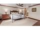 A cozy main bedroom featuring wood trim, a ceiling fan, and an en suite bathroom at 8749 E Via De Sereno --, Scottsdale, AZ 85258