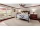 Cozy main bedroom with a ceiling fan, outdoor access and traditional furnishings at 8749 E Via De Sereno --, Scottsdale, AZ 85258