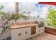 A well-equipped outdoor kitchen featuring a stainless steel grill and ample counter space at 8749 E Via De Sereno --, Scottsdale, AZ 85258
