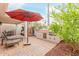 Inviting outdoor space with a built-in BBQ, a seating area, and a colorful umbrella at 8749 E Via De Sereno --, Scottsdale, AZ 85258