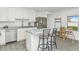 Stylish kitchen featuring granite countertops, stainless steel appliances, and a breakfast bar at 9208 W Coolidge St, Phoenix, AZ 85037