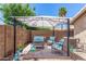 Cozy backyard patio area with a gazebo, seating, and decorative garden accents for relaxation and enjoyment at 9853 W Tonopah Dr, Peoria, AZ 85382