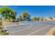 Exterior image of a basketball court in a community with blue surface and multiple hoops at 9853 W Tonopah Dr, Peoria, AZ 85382