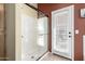 Bathroom featuring a glass-enclosed shower, neutral walls, tile floor and a door leading to the outside at 9853 W Tonopah Dr, Peoria, AZ 85382