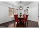 Inviting dining area featuring a stylish chandelier and hardwood flooring at 9853 W Tonopah Dr, Peoria, AZ 85382